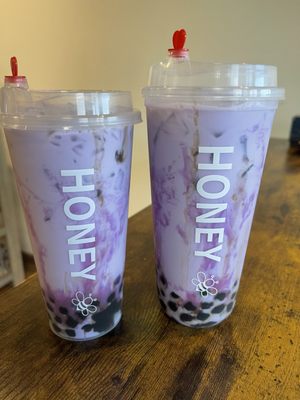 Two colorful Honey B Café boba drinks
